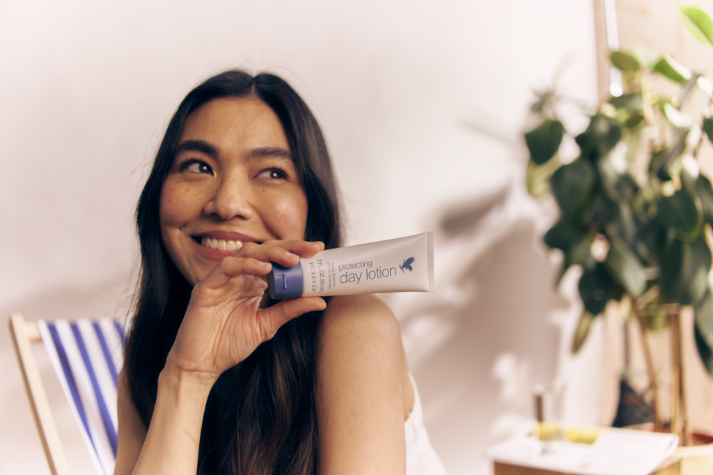 asian woman with a creme in her hand